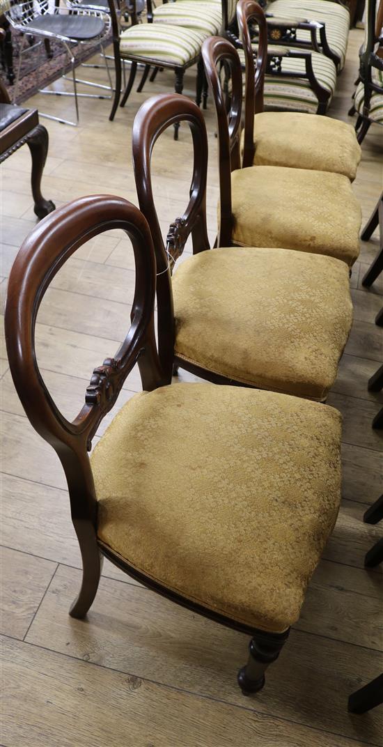 A set of four Victorian mahogany balloon back dining chairs